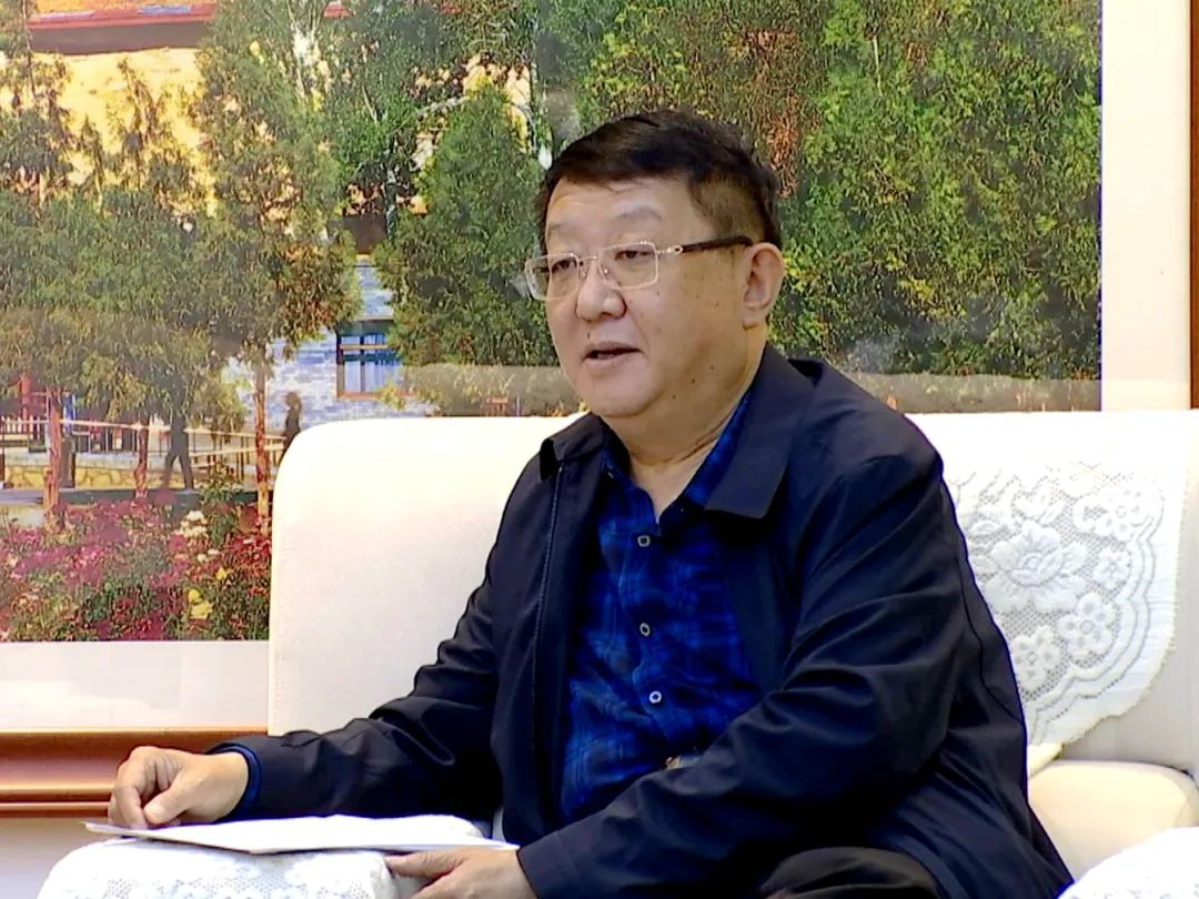 唐晓明会见解居志一行