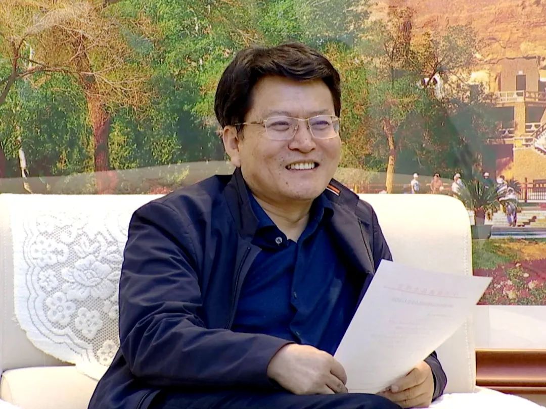 唐晓明会见解居志一行