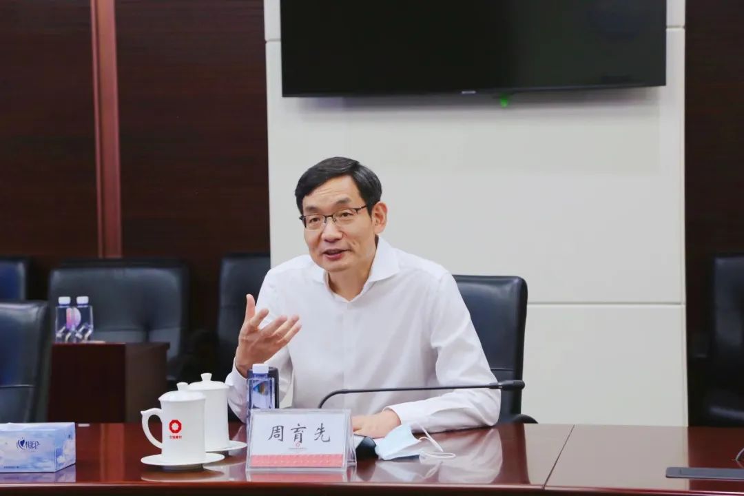 周育先会见奕斯伟集团董事长王东升一行