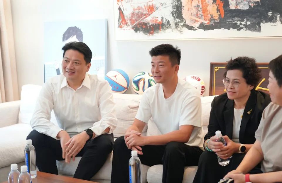 Rallying Behind Success: District Leaders Meet with Shanghai Tennis Team’s Head Coach