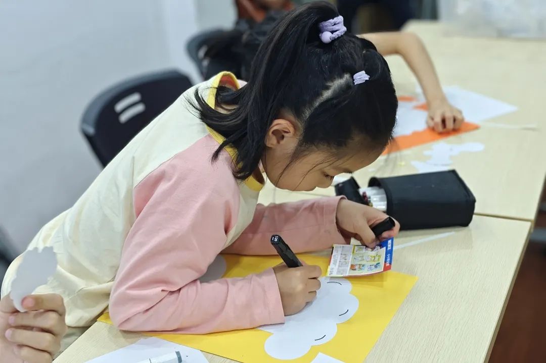Children creating artwork to honor workers.